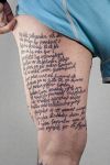 texts tattoo on thigh